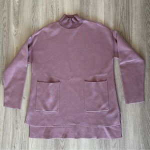 Soft and warm purple turtleneck sweater with pockets